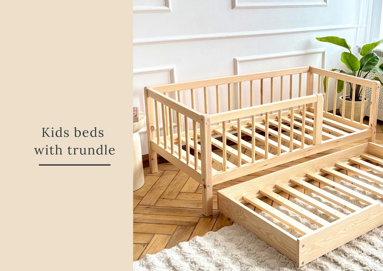 Wooden kids bed with drawer and safety rails